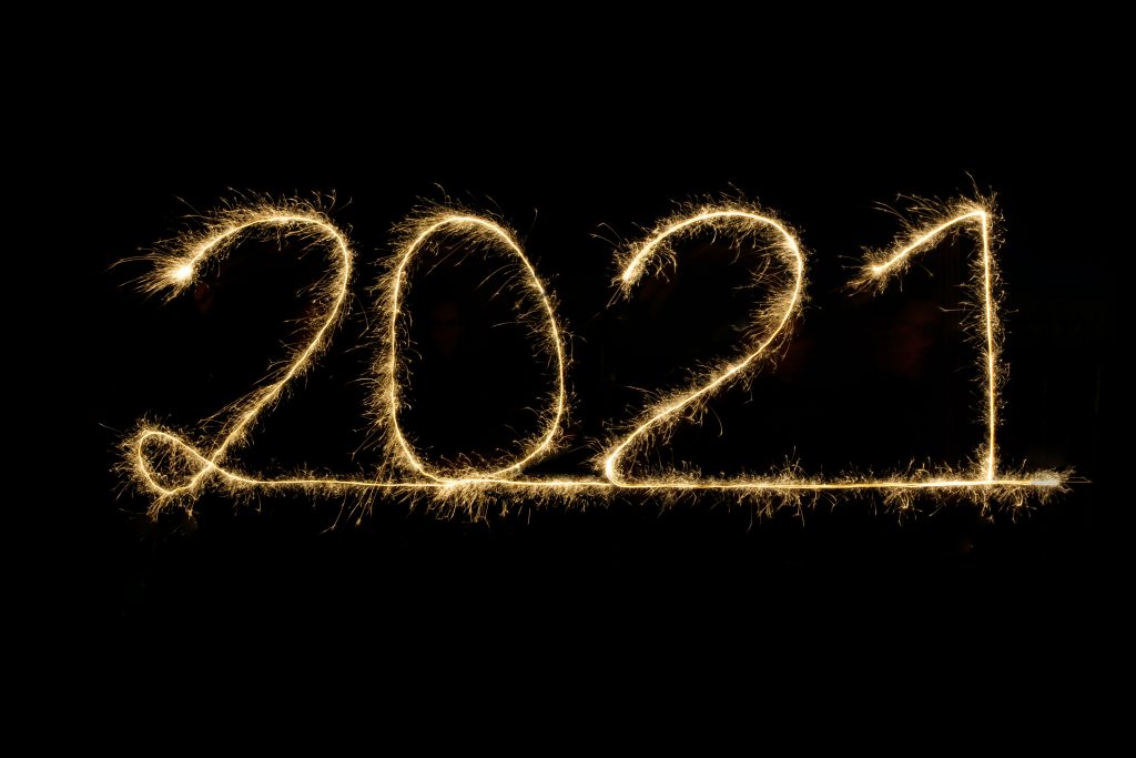 2021 written in sparkling gold on a black background